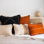 Decorative pillows on a sofa with a neutral color palette