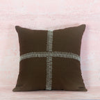 Brown pillow with a white zipper design 