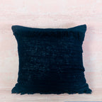 Dark blue textured pillow with horizontal fringe top and bottom 