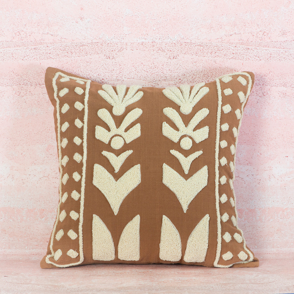 Decorative pillow with a brown and beige pattern 
