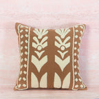 Decorative pillow with a brown and beige pattern 