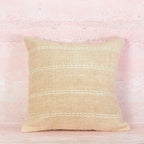 Peach cushion with horizontal white stitching