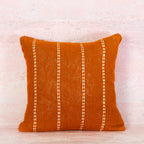 Terracotta pillow with white stitching 